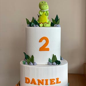 Two tiered crocodile kids cake