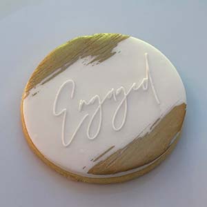 Pink with gold trim engagement cookies